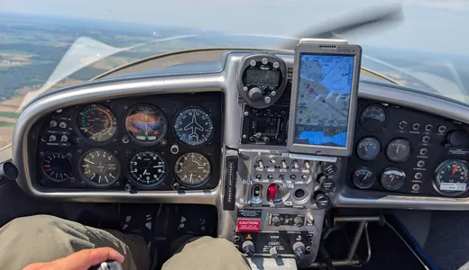 The instrument panel and stick, seen from the seat in flight